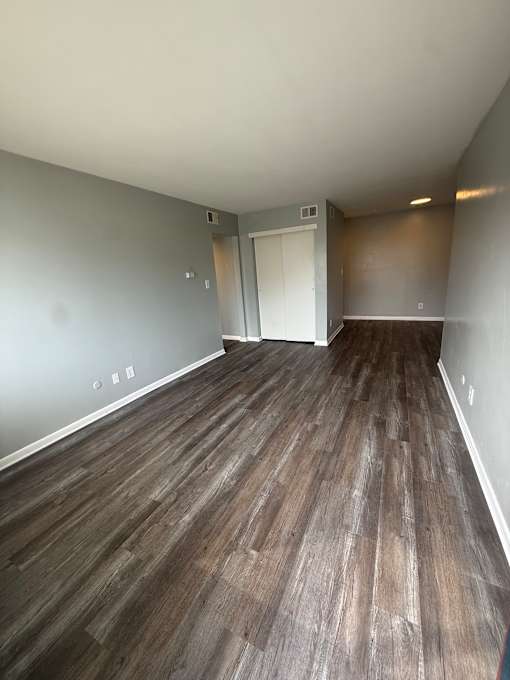 A wall of wood paneling runs along the wall.