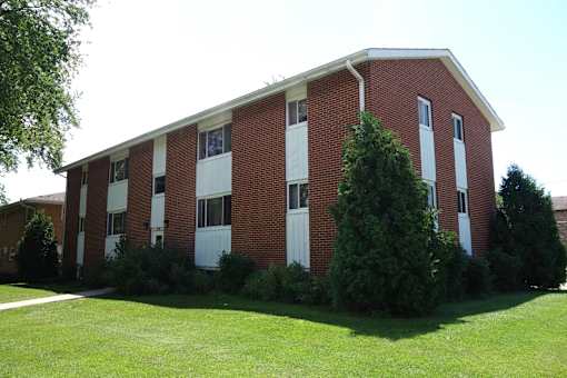 A red brick building with white trim and windows.