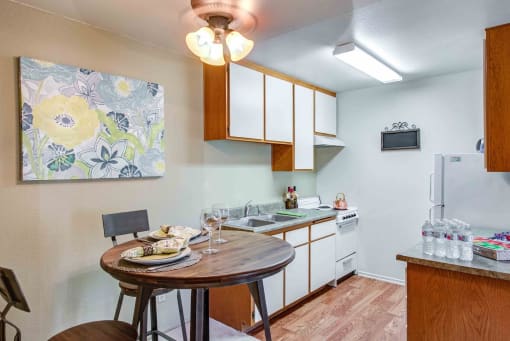 a kitchen with a dining table and a sink