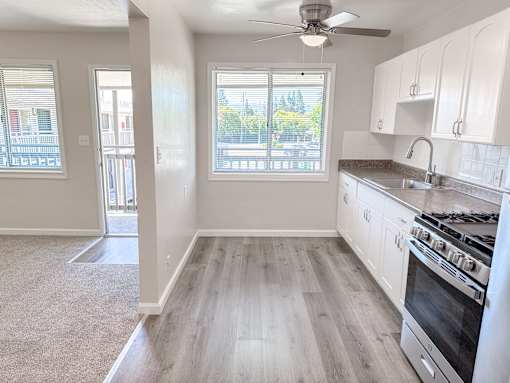 Willow Manor 1bed 1 bath floorplan - living room and kitchen separated by a half wall with windows in both rooms