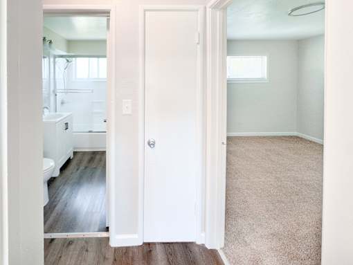 Willow Manor 1bed 1 bath floorplan - hallyway with a closet and a door to the bathroom and another to the bedroom.
