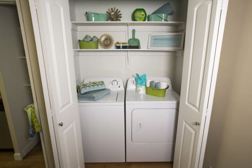 Model home laundry room and shelves at Abby Creek Apartments, Carmichael, CA 95608 