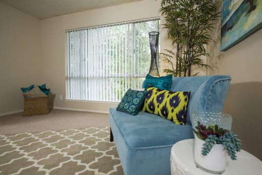 Model home living room and large window at Abby Creek Apartments, California, 95608