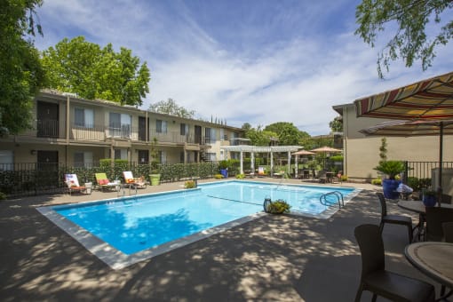 Swimming pool and pool furniture at Abby Creek Apartments, Carmichael, 95608 