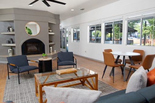 Leasing office seating area, fireplace, and windows at Willow Grove Apartments, Sacramento