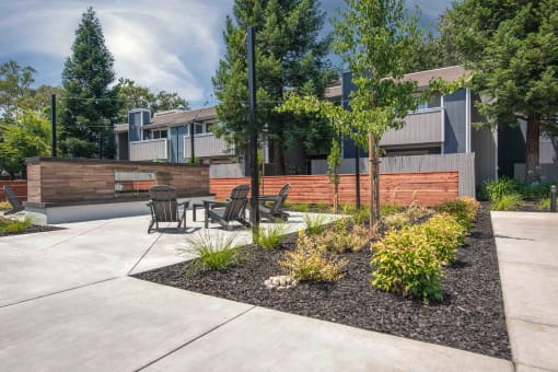 Courtyard with a table and chairs and fireplace  at Willow Grove Apartments, Sacramento, 95825