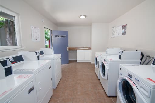Laundry Facility with multiple washer and dryer machines at Willow Grove Apartments, Sacramento, CA