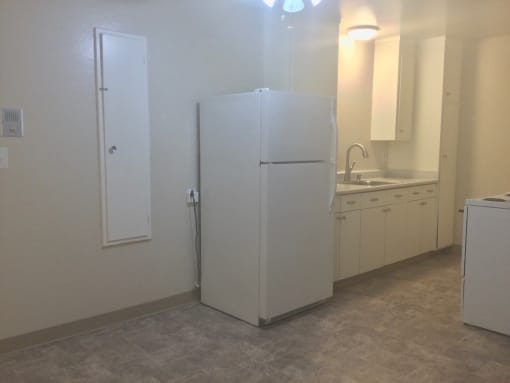 Kitchen with a refrigerator and a sink