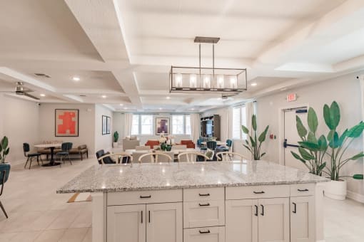 Community kitchen and living room at Swiftwater apartments in Port Charlotte, FL