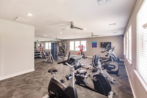 fitness center with cardio equipment at Swiftwater apartments in Port Charlotte, FL