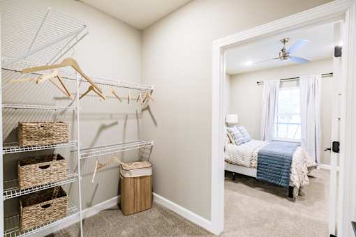 a room with a closet and a bed in it