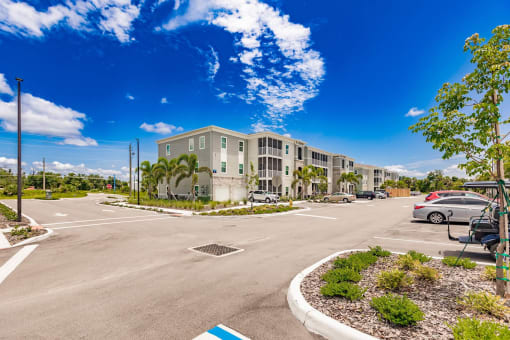 an empty parking lot in front of Swiftwater apartments in Port Charlotte, FL