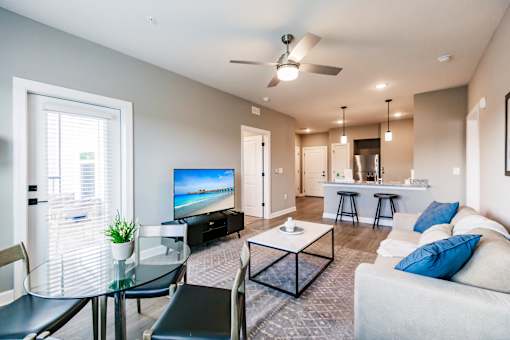 a living room with a couch and a glass table