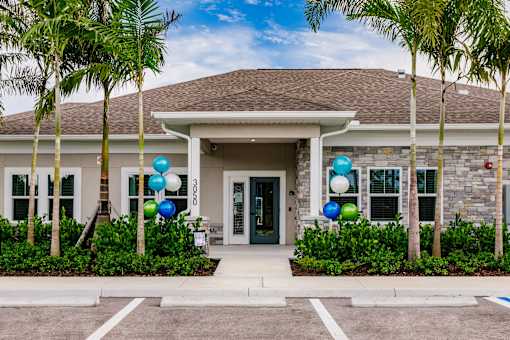 exterior view of Vantage Apartments clubhouse in cape coral, fl