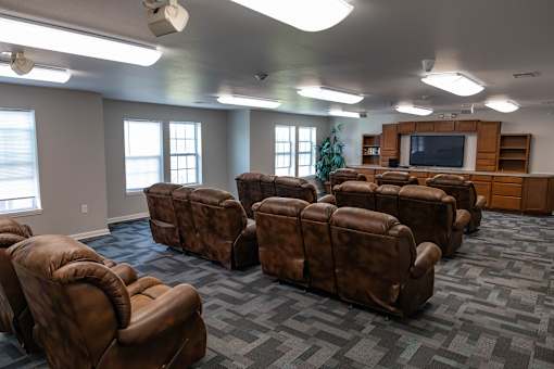 a picture of brown chairs and a tv