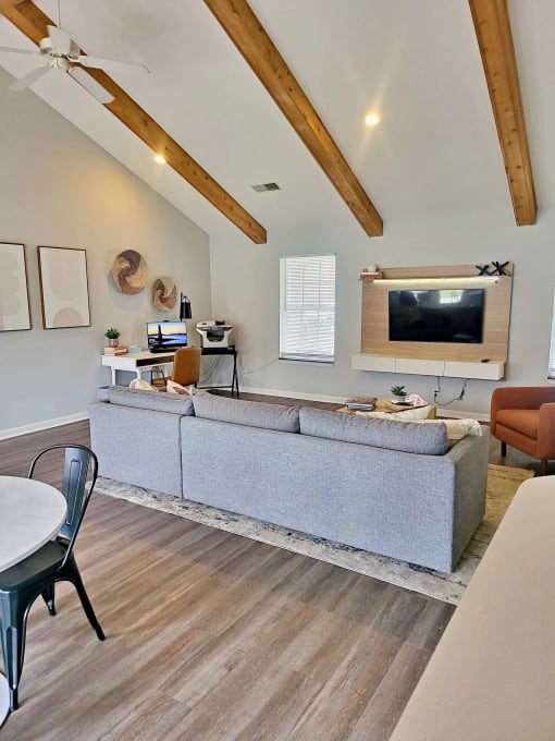 a living room with a couch and a tv