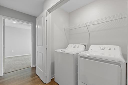 A laundry room with a washer and dryer.