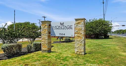 A sign for Montage 7554 is displayed in front of a grassy area.