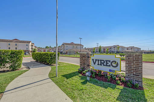 A sign that says Vireo in front of some houses.