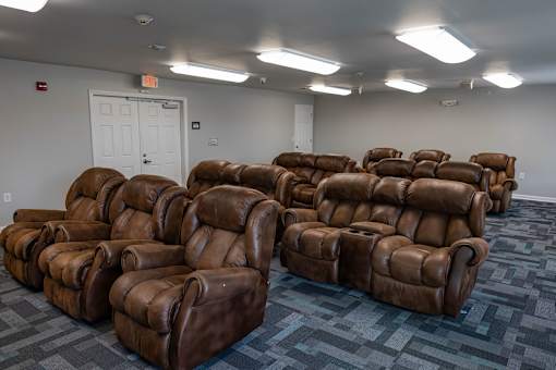a picture with brown chairs