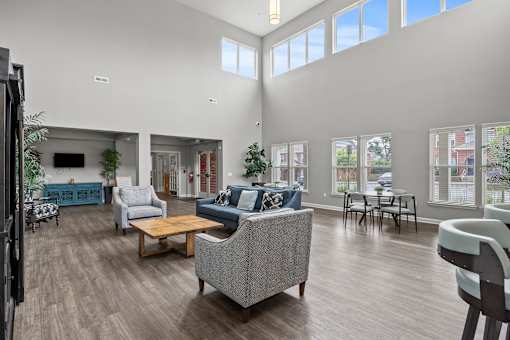 A living room with a grey sofa and a wooden coffee table.