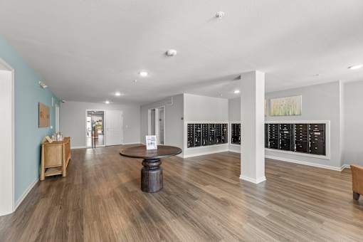 A spacious room with wooden floors and a white ceiling.