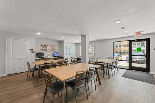A conference room with a long table and chairs.