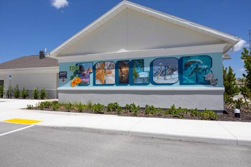 A building with a mural on the side of it.