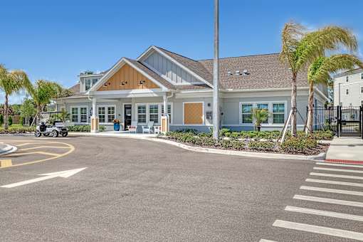 A large building with a parking lot in front of it.