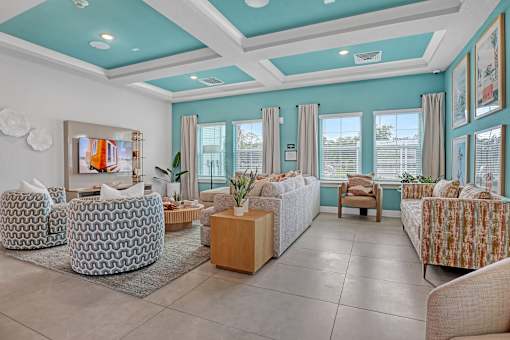 A living room with a sofa, armchairs, and a coffee table.