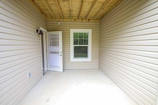 A small room with a door and a window.