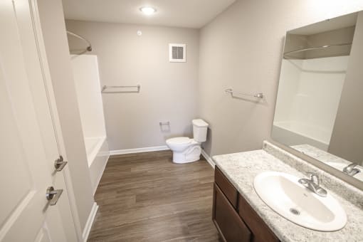Bathroom with toilet and sink at Meadows on Main in Whitestown, Indiana