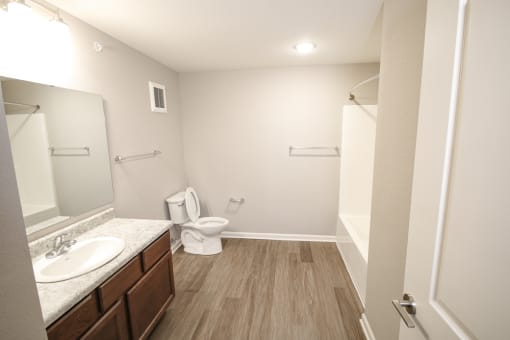 Bathroom with toilet and sink at Meadows on Main in Whitestown, Indiana