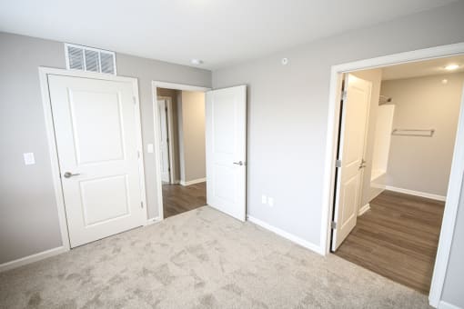 Empty bedroom with bathroom at Meadows on Main in Whitestown, Indiana