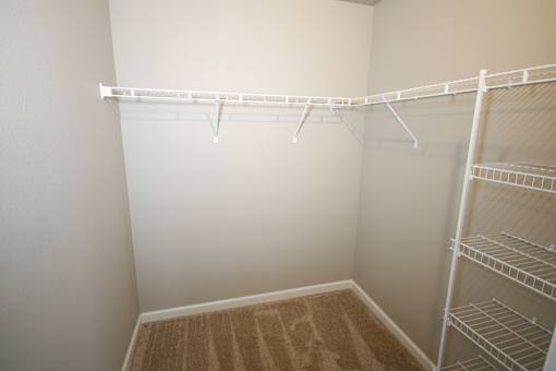 Empty white shelves in a room.