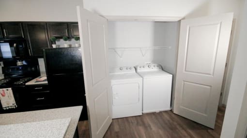 a white washer and dryer in a room at Mosaic Apartments in Avon, Indiana