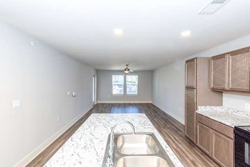 A kitchen with a sink and a window.