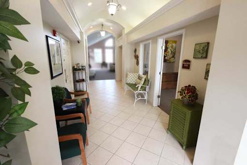 a hallway with chairs at canterbury apartments in kalamazoo, mi