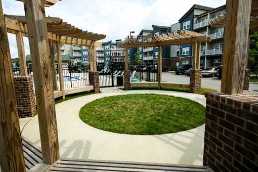 A small grassy area surrounded by wooden beams.