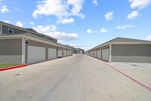 A long row of garage doors are closed.