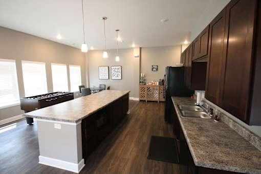 A kitchen with a large island in the middle of the room.
