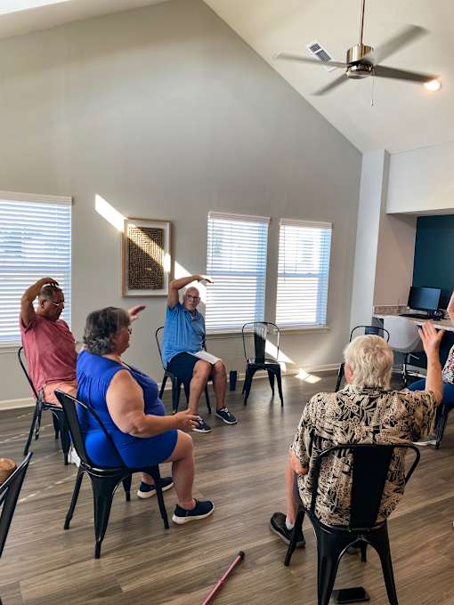 a group of people sitting in a circle in a room