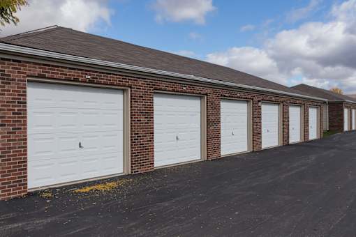 A long row of garage doors are closed.