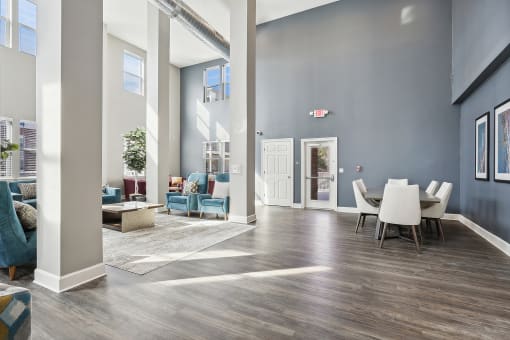 Lobby with couches, chairs, and coffee tables at The Lofts in Slidell, LA