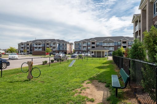 Dog park with a bench at Mosaic Apartments in Avon, Indiana