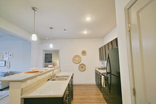 a kitchen with stainless steel appliances and granite counter tops
