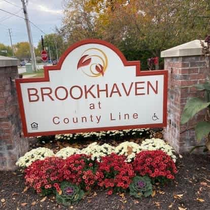 A sign that says Brookhaven at the County Line.