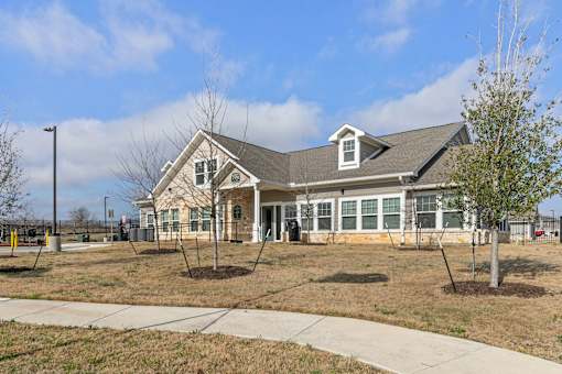 exterior view of Agave East apartment clubhouse in Del Valle tx