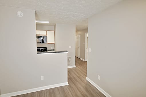 A kitchen area with a counter and cabinets.