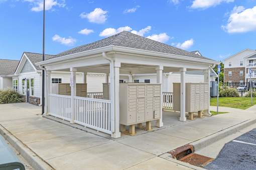 A small white building with a porch and a covered entrance.